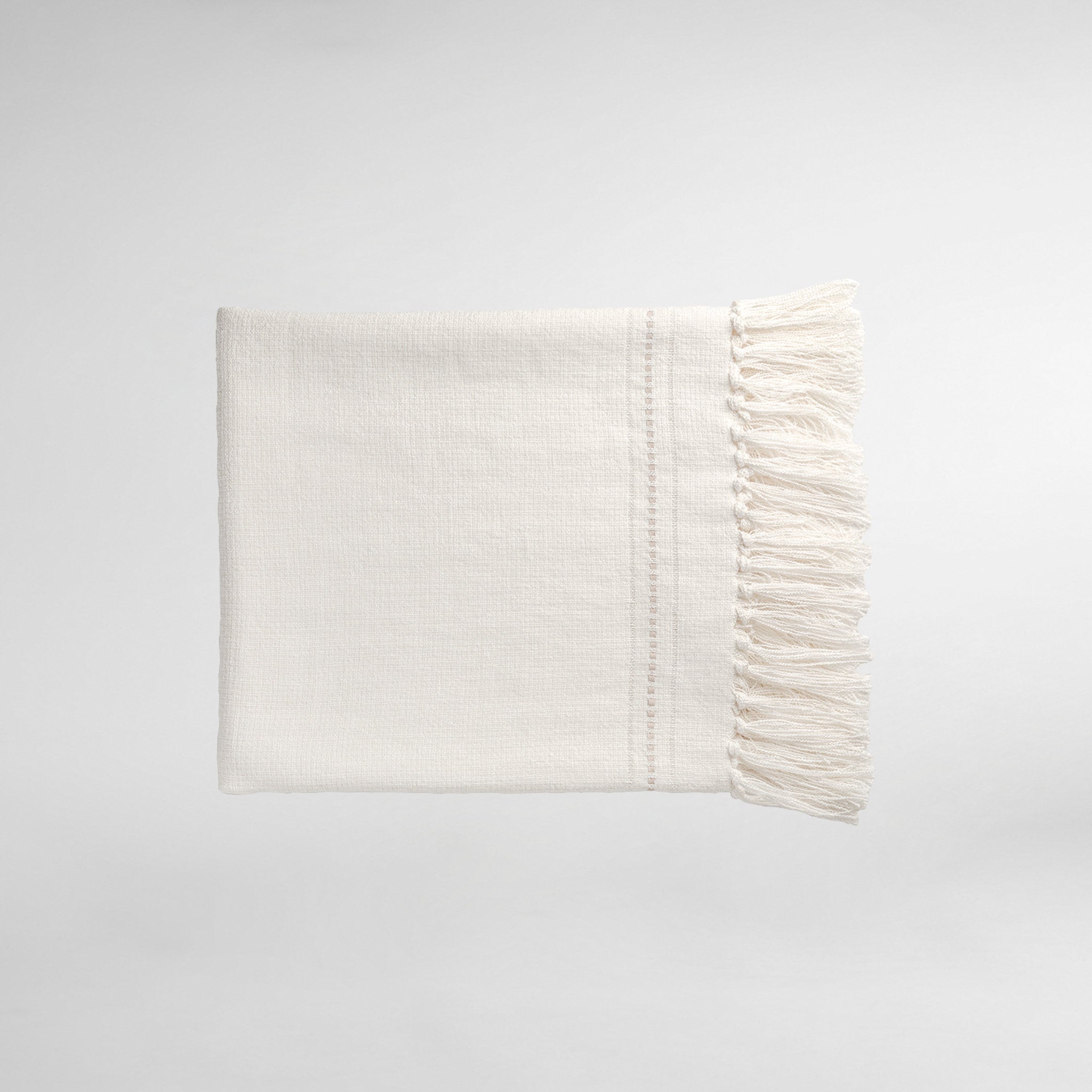 Hoxton Throw with Fringe and Leather Detail - Sesame.